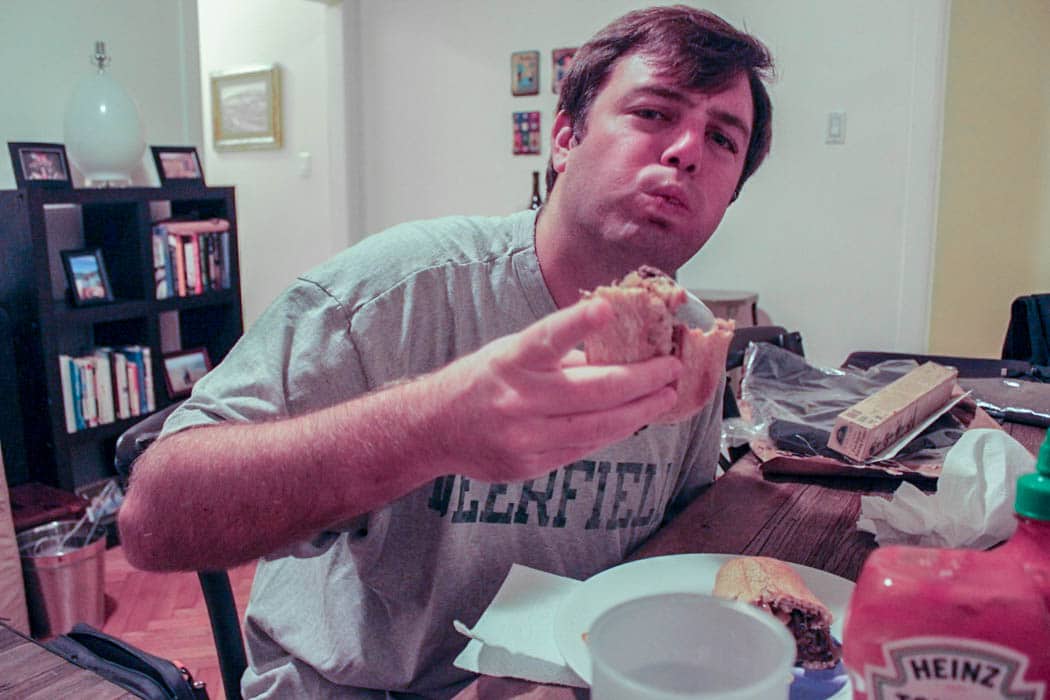 Dude-eating-philly-cheesesteaks-2