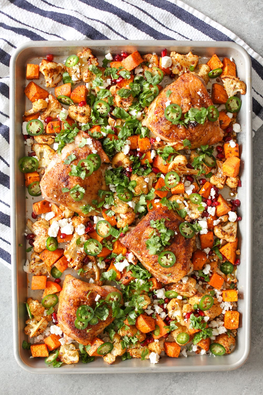 Sheet Pan Chicken Thighs with Cauliflower, Sweet Potatoes, and Pomegranate